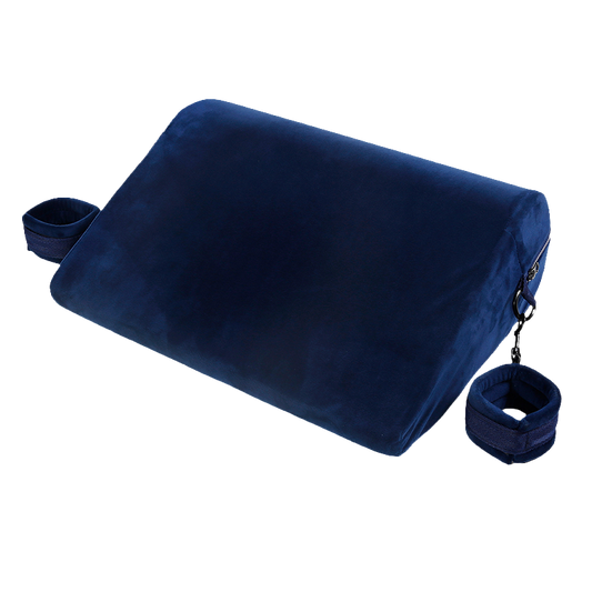 Velvet blue triangle sex pillow with rounded corners and attached cuffs on both sides