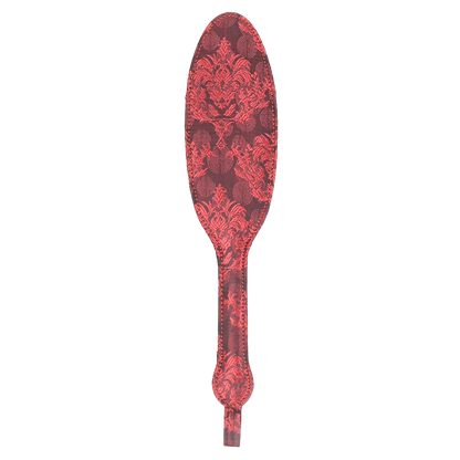 Decorative paddle with red vintage floral pattern on a white background